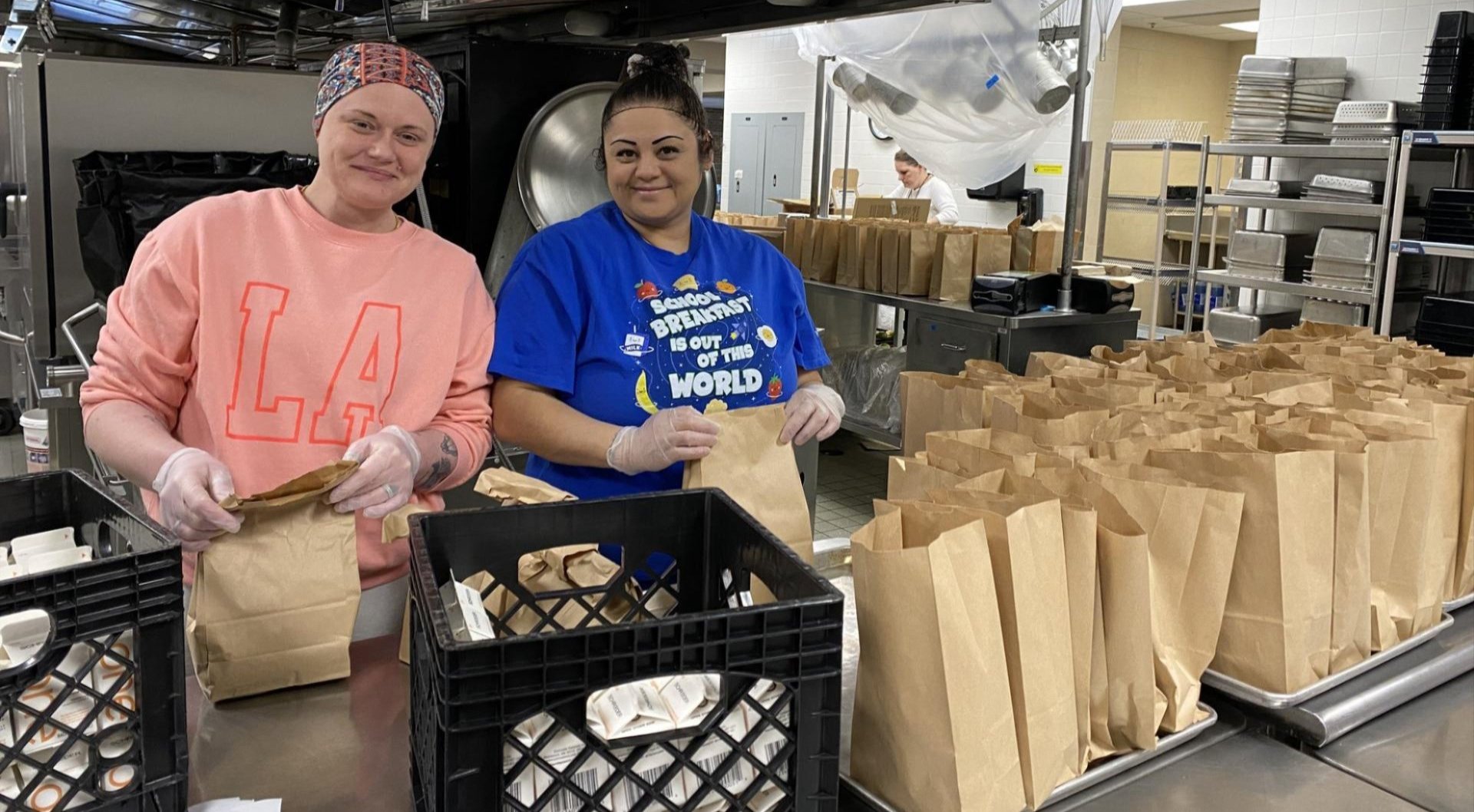 Nutritional Services staff bagging lunches