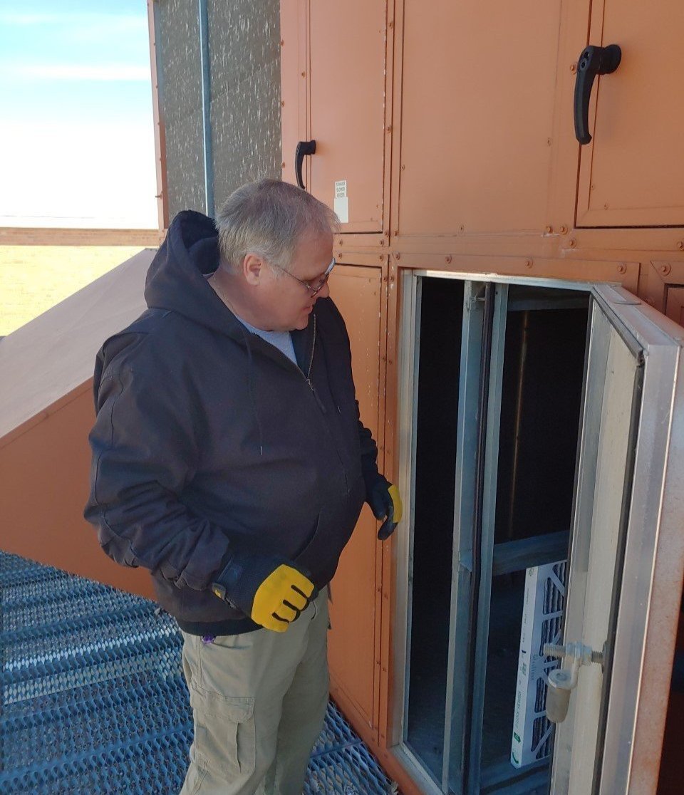 Buildings and Grounds staff - changing air filters