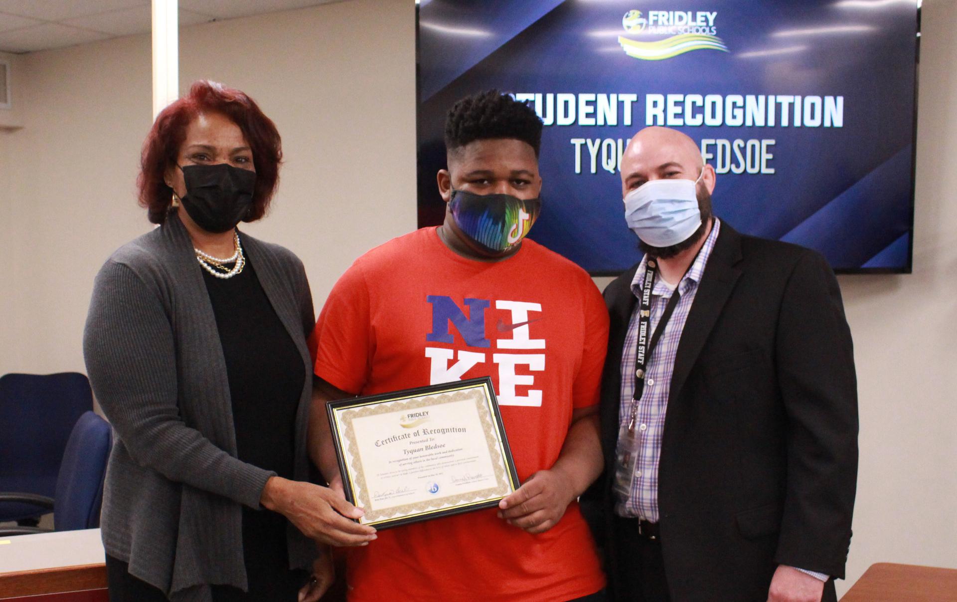 Tyquan Bledsoe was recognized at the May 2021 School Board  meeting for his commitment to service. Pictured is Superintendent Dr. Kim Hiel, Bledsoe, and FHS Assistant Principal Kelly McConville. 