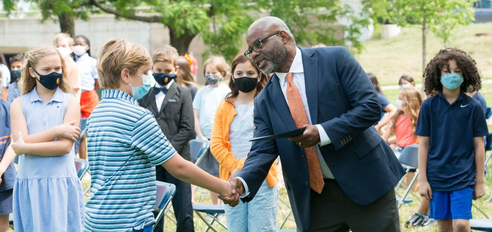 Randall Dunn Shaking Hand Of Lower School Graduate