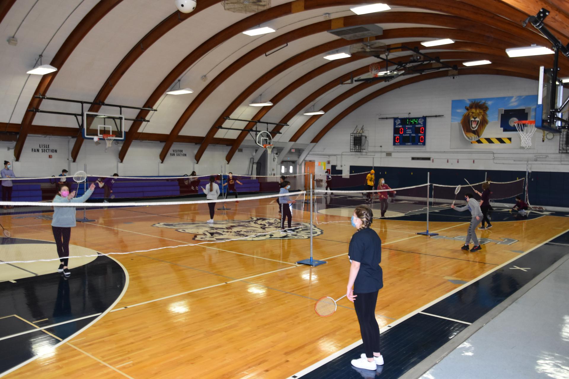 junior high students playing volleyball
