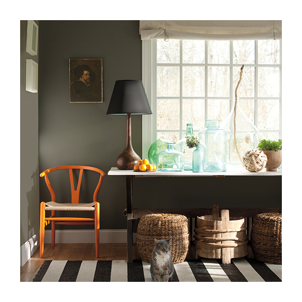A dark gray painted room with white trim and ceiling.