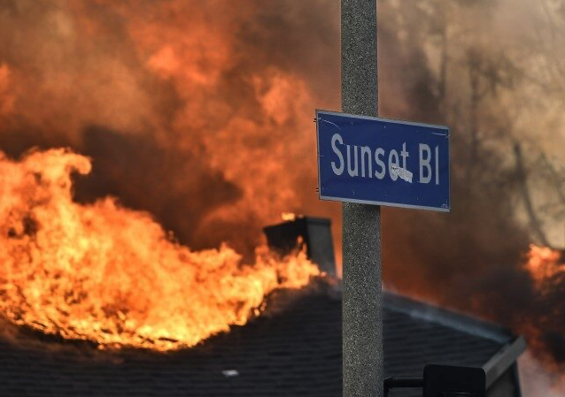 Fires devastate Los Angeles, killing at least 10 while charring neighborhoods to apocalyptic scenes