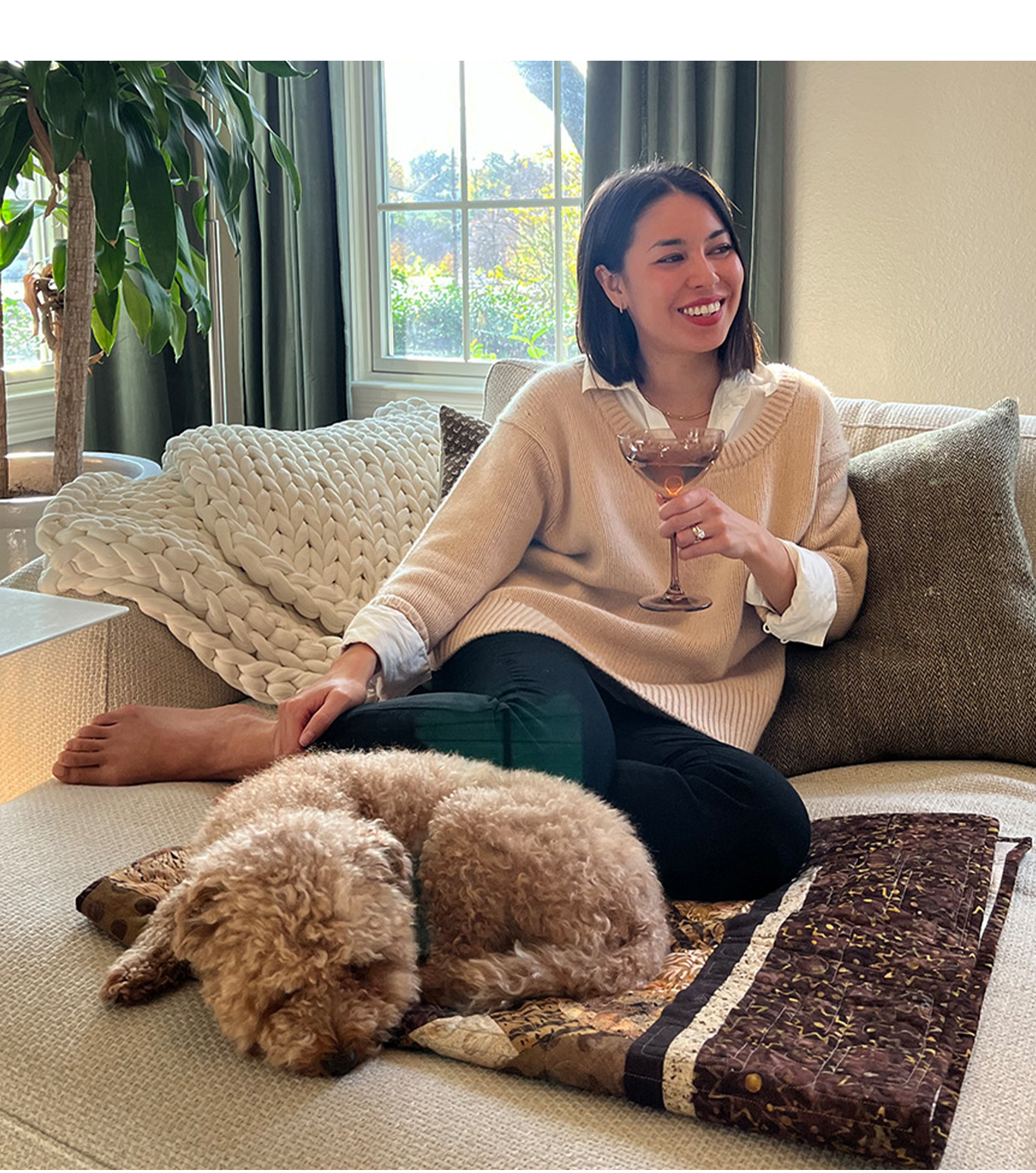Woman wearing the Theo sweater