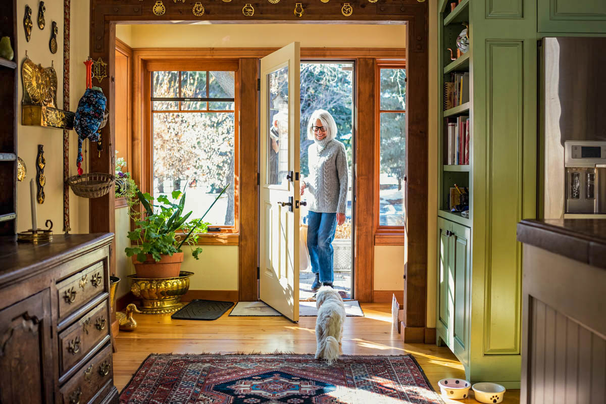 Women inside her house with her dog