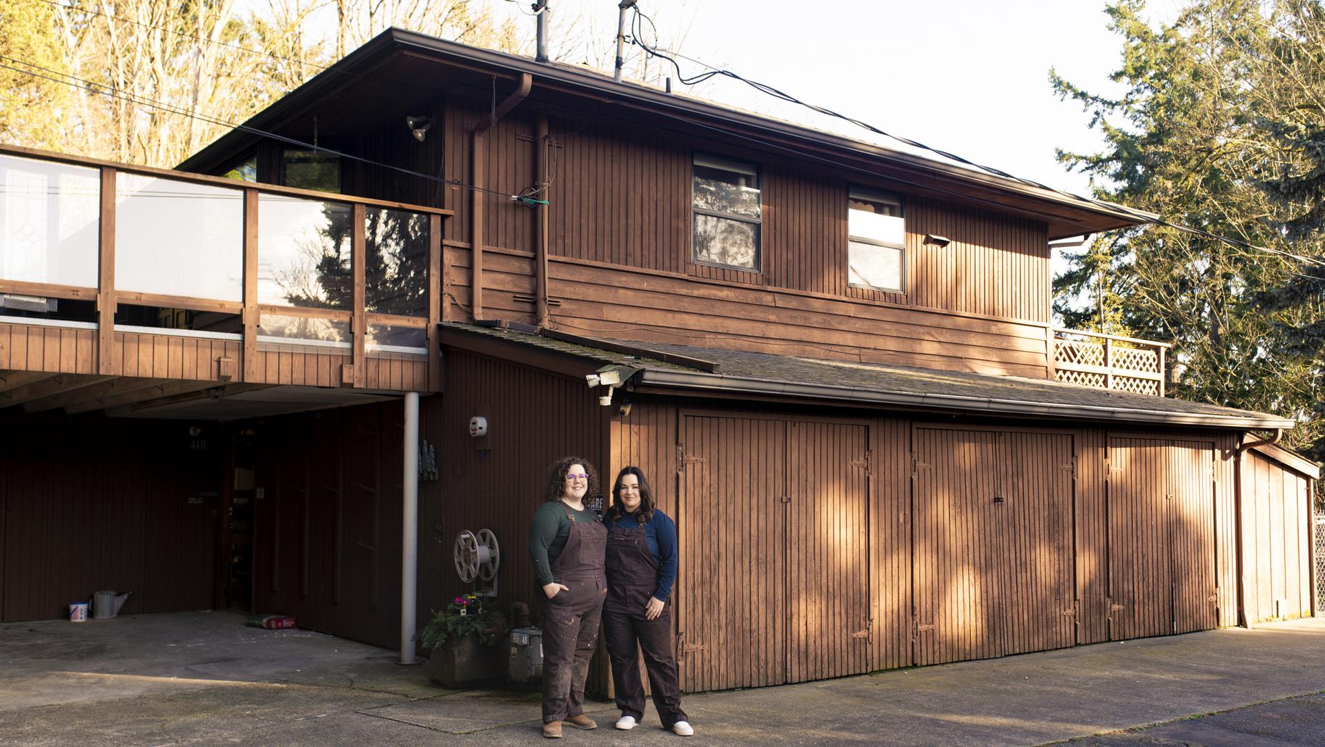 two friends standing outside their hosue