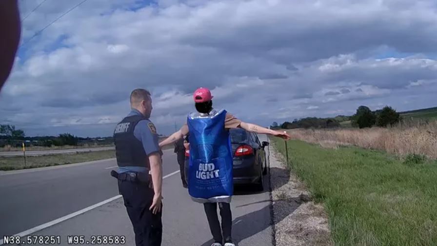 A man in a beer can costume during a field sobriety test