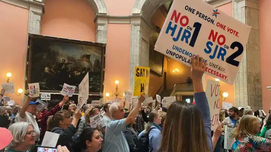 A room full of supporters and opponents of the new measure 