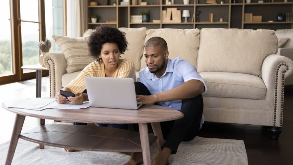 Couple at home with device