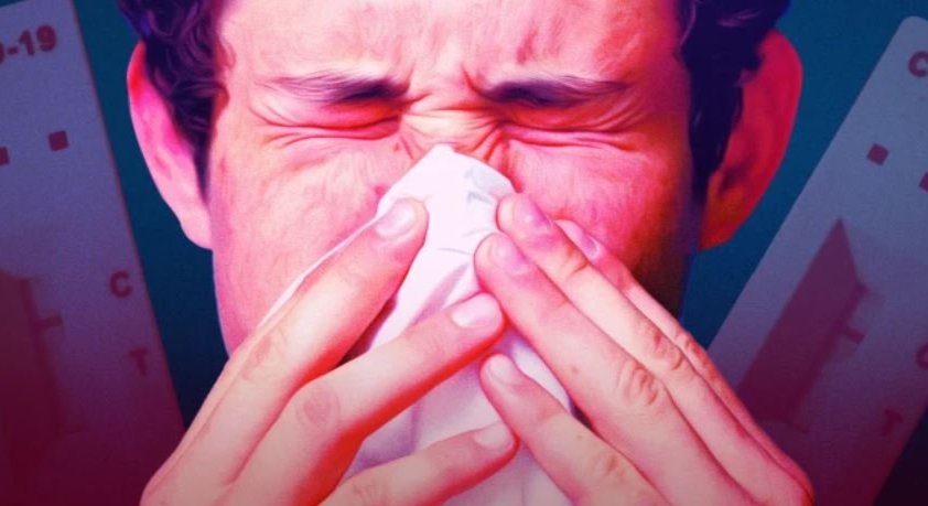 Man blowing his nose