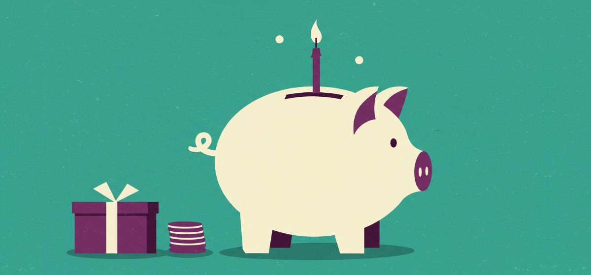 a piggy bank with a birthday candle on top