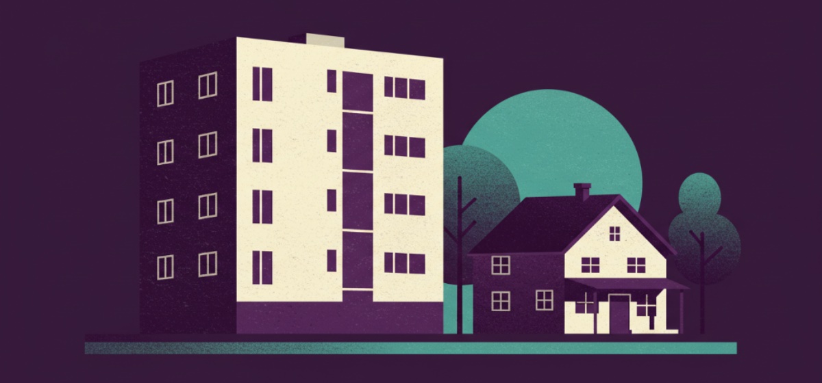 an apartment building next to a house