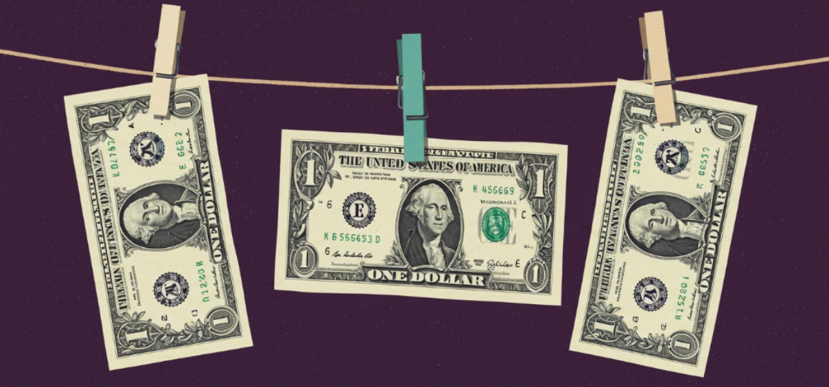 Dollar bills hanging on a clothesline