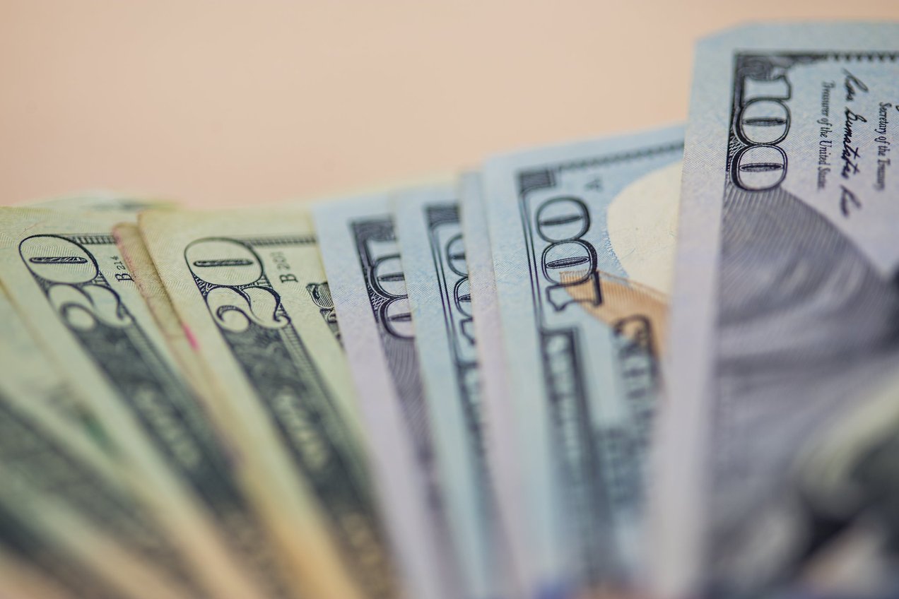 paper currency fanned out to show different kinds of bills