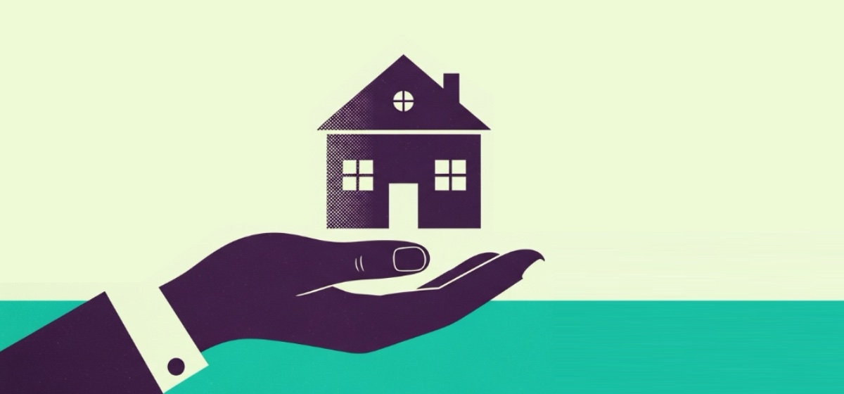 Hand giving a miniature house