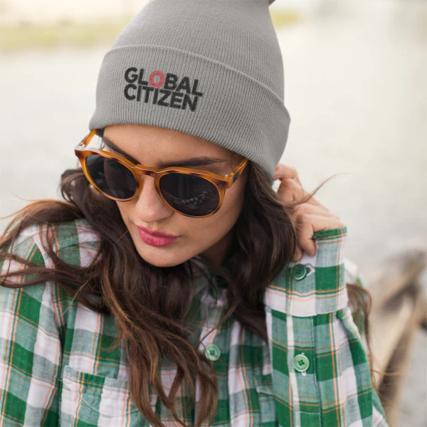 A person wearing the gray Global Citizen Everyday Knit Beanie