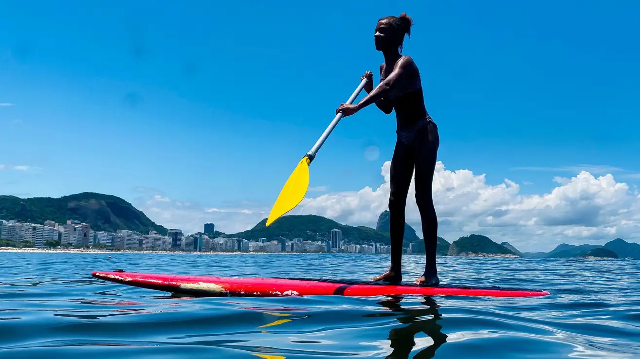 Someone paddle boarding 