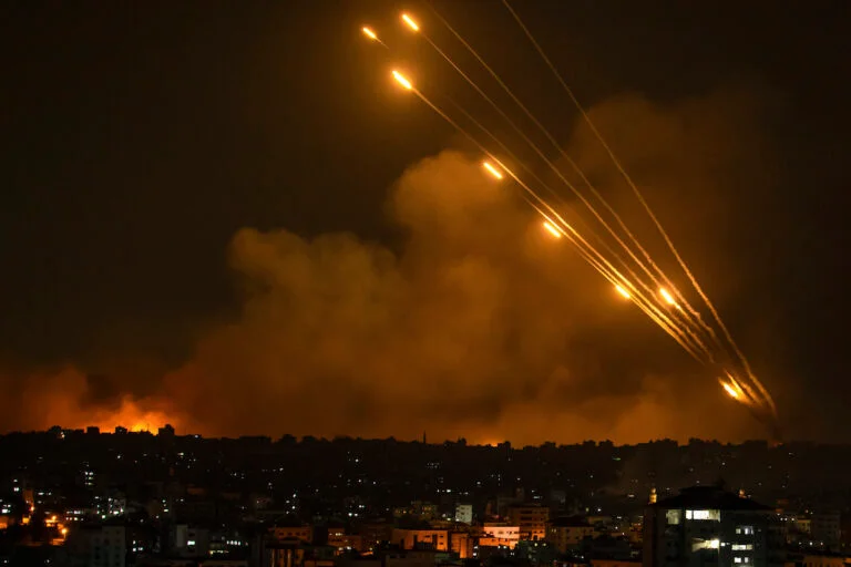 Rockets are fired toward Israel from the Gaza Strip, Sunday, Oct. 8, 2023. 