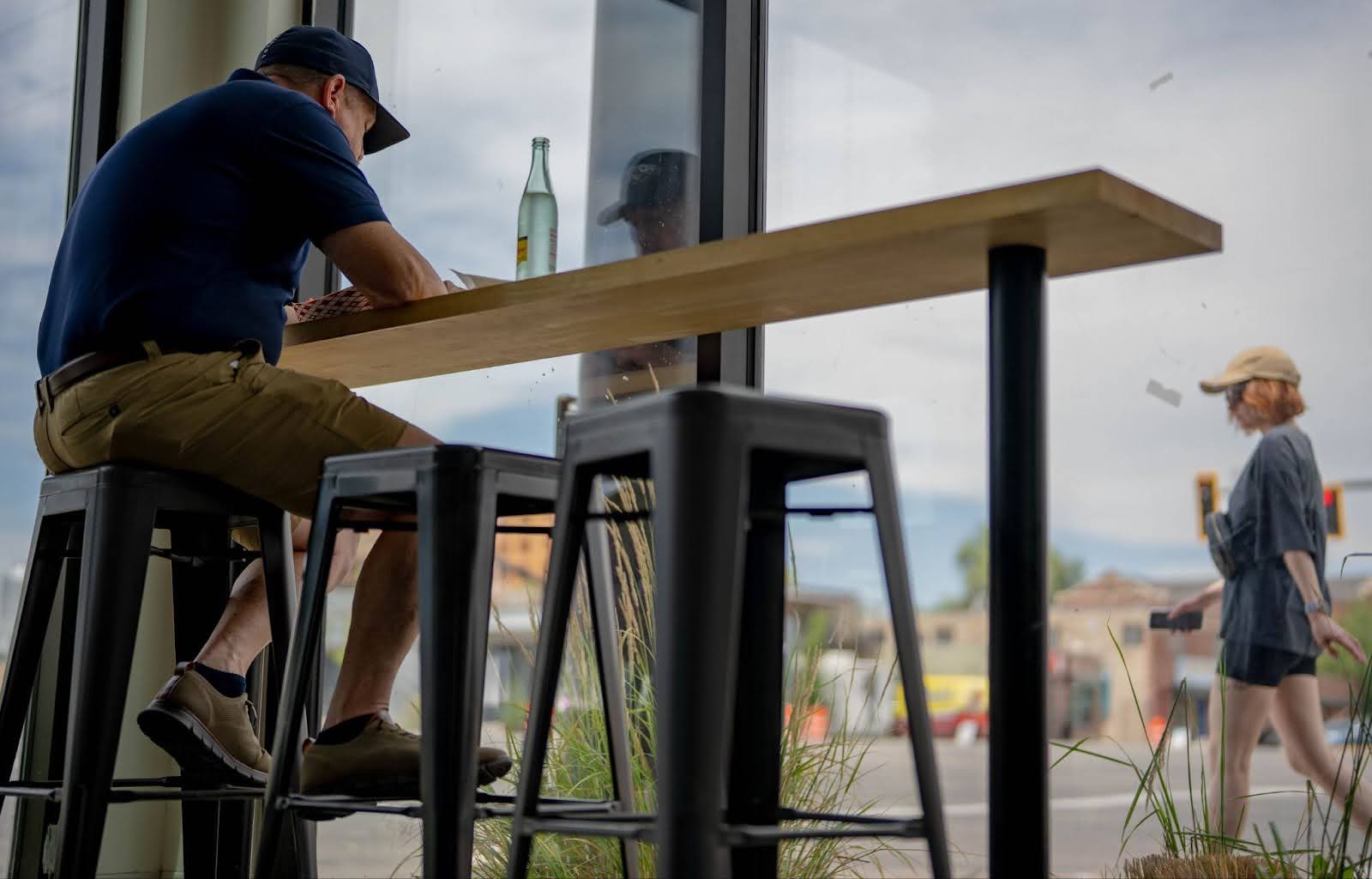 Person dining inside the Cluck Truck restaurant