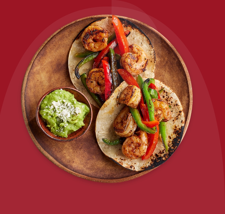 Get all the flavor without all the prep time with Shrimp Fajitas with Whole Wheat Tortillas & Guacamole.