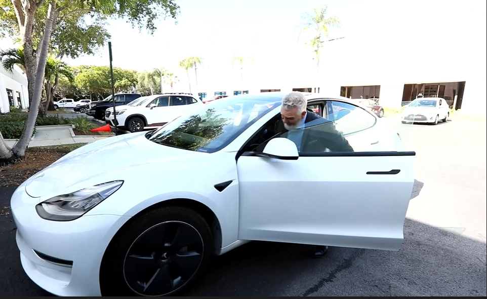 Man with Tesla