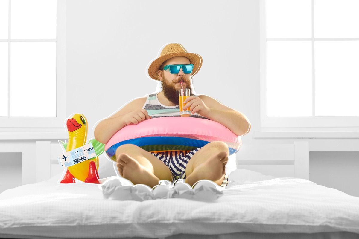 Man in an inflatable tube on a bed