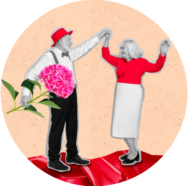 Old couple dancing while the man holds a giant flower