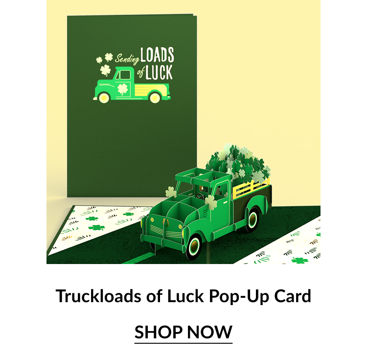 Green pop-up card featuring a vintage truck filled with clovers, with the message ''Sending Loads of Luck.'' Shop Now.