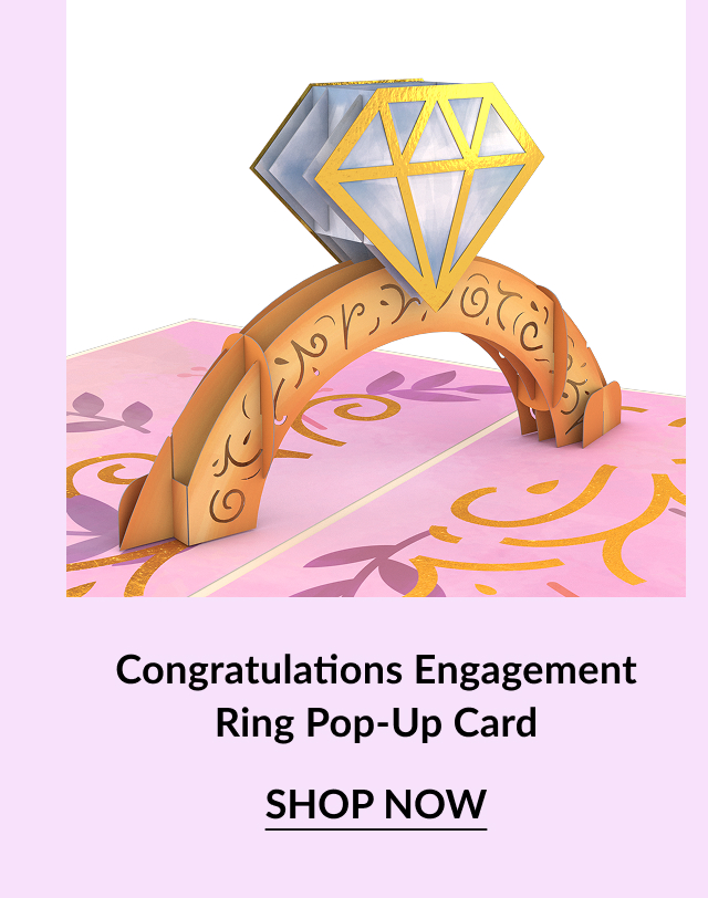 A pop-up card featuring a golden engagement ring and a diamond on a pink background, with ''Congratulations'' text.