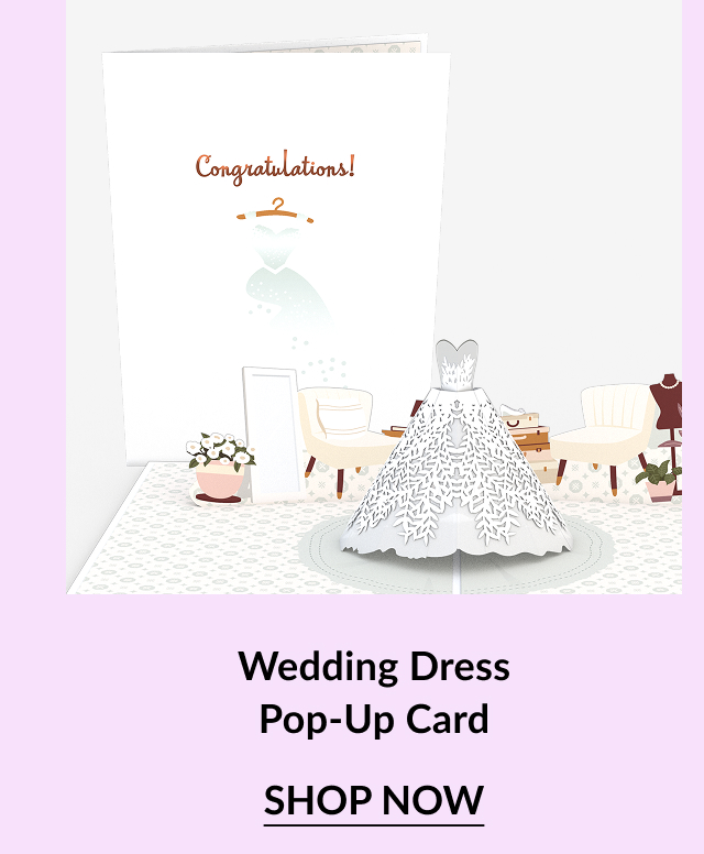 A pop-up card featuring a white wedding dress inside, surrounded by furniture and flowers, with ''Congratulations!'' printed above.
