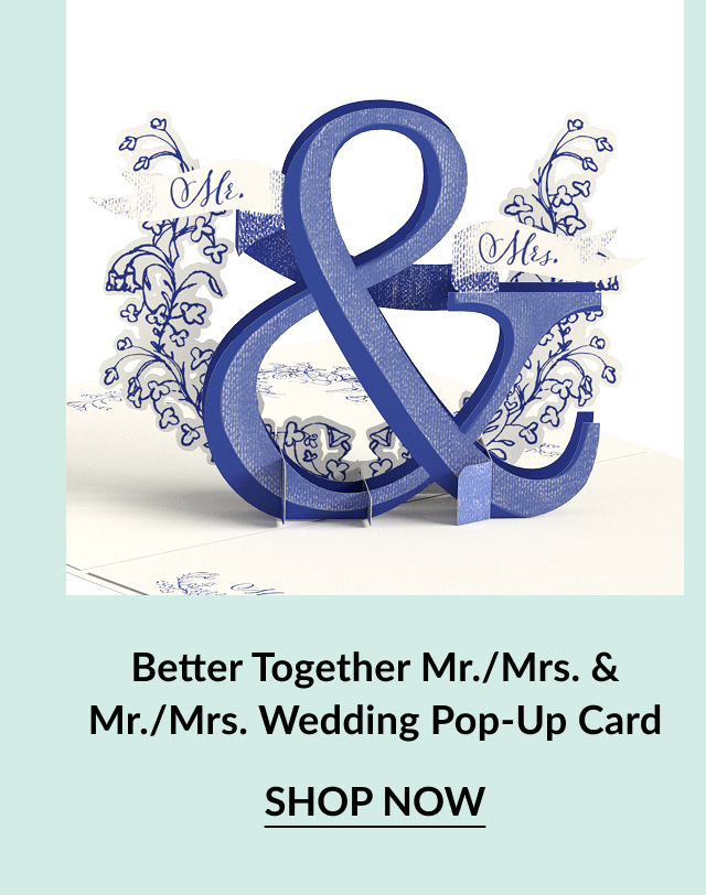 A blue pop-up wedding card featuring ''Mr. & Mrs.'' with floral designs, beautifully crafted for celebrations of love.
