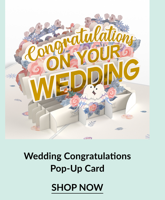 A colorful pop-up card featuring ''Congratulations on Your Wedding'' with floral accents and two doves, inviting viewers to shop now.
