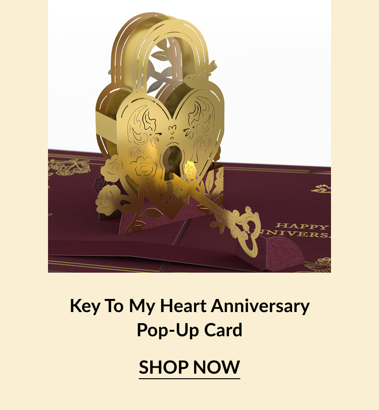 Golden pop-up card featuring a heart-shaped lock and key, with ''Happy Anniversary'' elegantly printed on a maroon background.