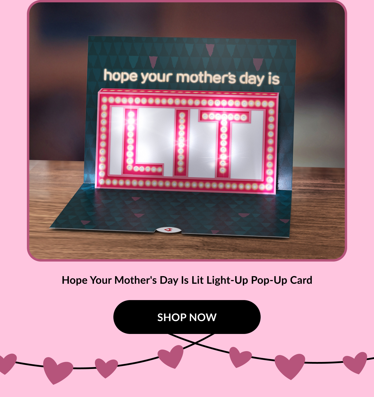 A pop-up Mother's Day card that lights up, featuring the message ''hope your mother's day is LIT'' in vibrant pink letters.