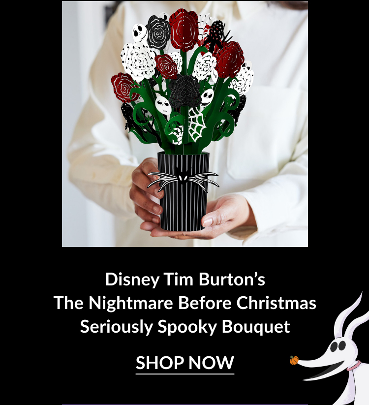Nightmare Before Christmas bouquet featuring red, white, and black spooky roses with skull motifs, in a black and white striped vase.