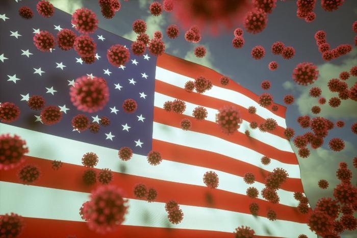 American flag with germs floating in front of it