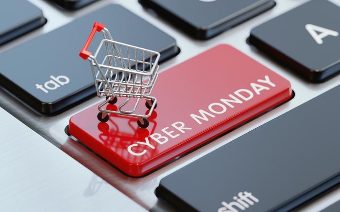 A tiny shopping cart on a cyber monday keyboard button