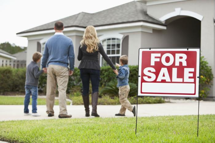 Family approaching home for sale.