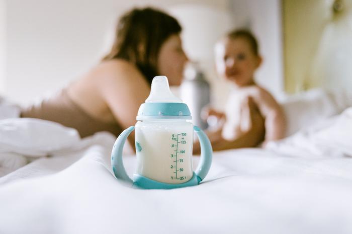 Baby bottle with milk in it.