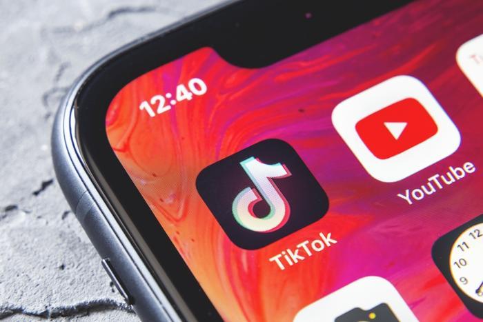 iphone with tikotok app on screen