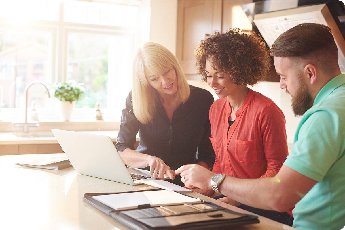 A couple exploring financing options with an expert