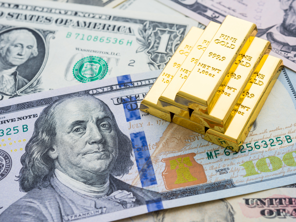 Image of dollar notes and gold bars
