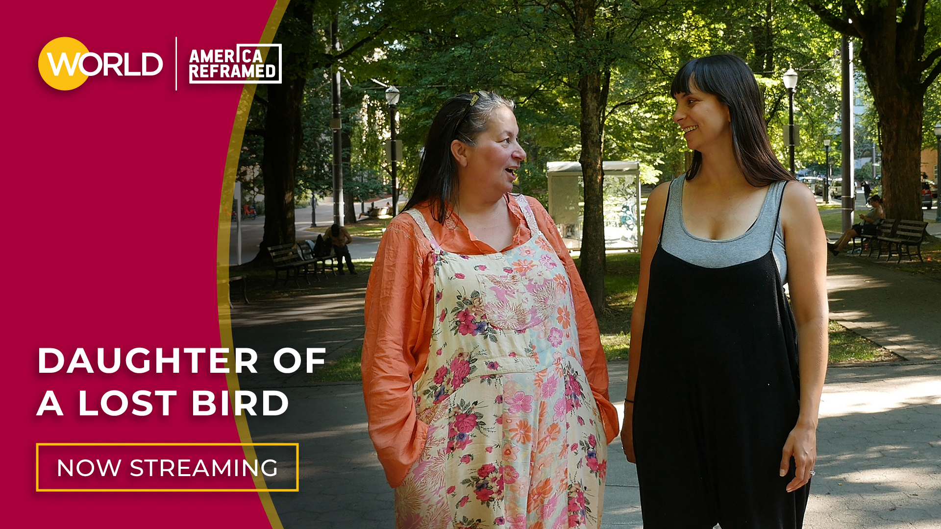 Kendra and her mother April stand in a park smiling at each other. Click here to watch Daughter of a Lost Bird.