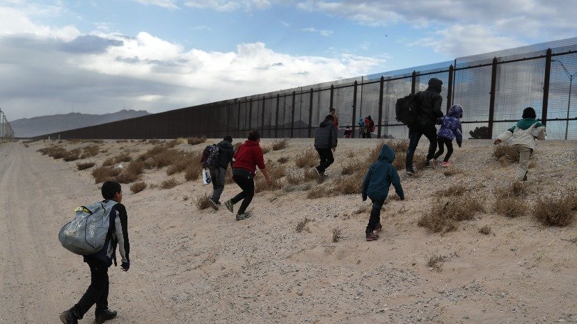 People trying to cross the border (The Hill)