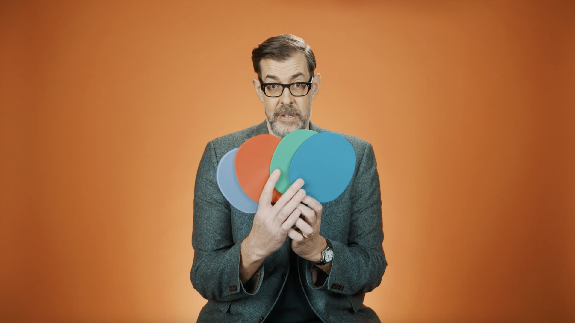 A photo of Richard Osman taking part in a quiz