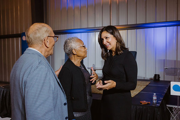 [IMAGE] Amna Nawaz with members at 65th Anniversary event