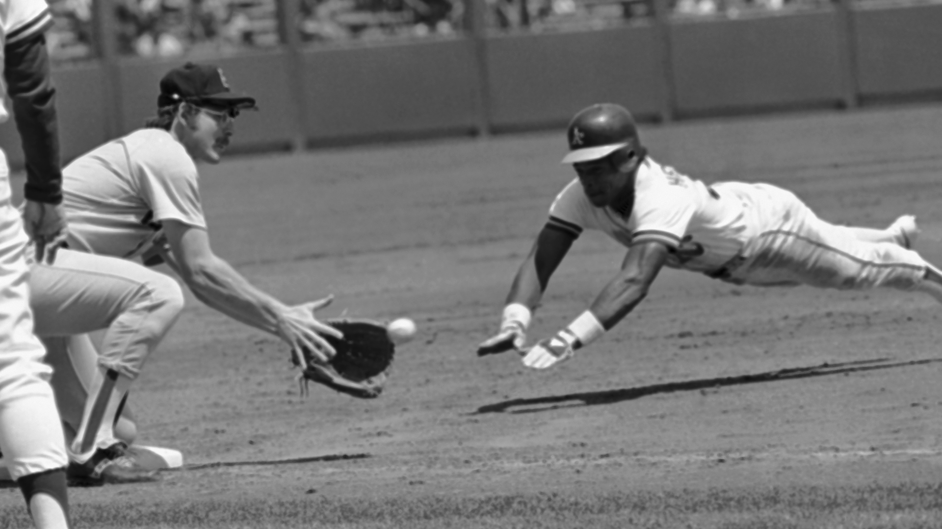 Carney Lansford (left) and Rickey Henderson