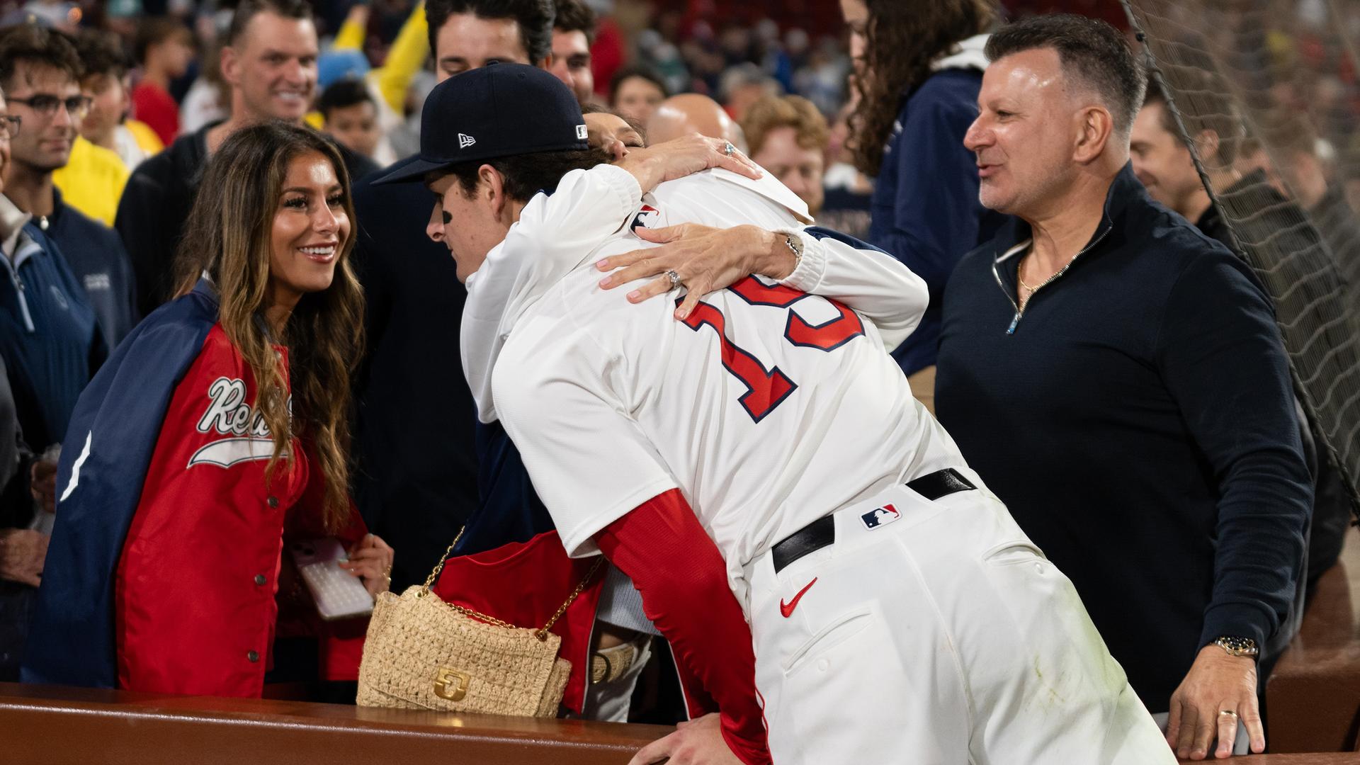 Roman Anthony hugging his family