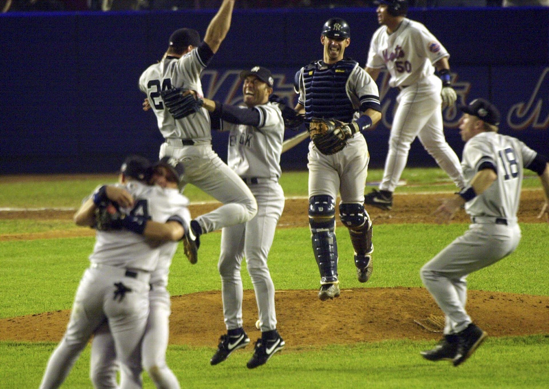 The Yankees celebrate the final out of the 2000 World Series