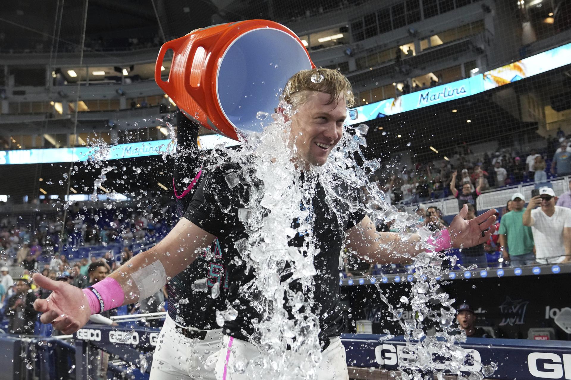 Kyle Stowers is doused with ice after hitting a walk-off grand slam 